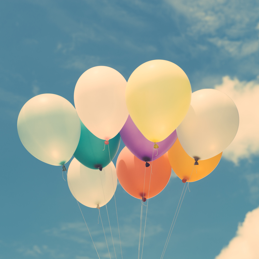 Lots of colorful balloons on the blue sky, concept of love in summer and valentine, wedding honeymoon. Vintage effect style pictures.